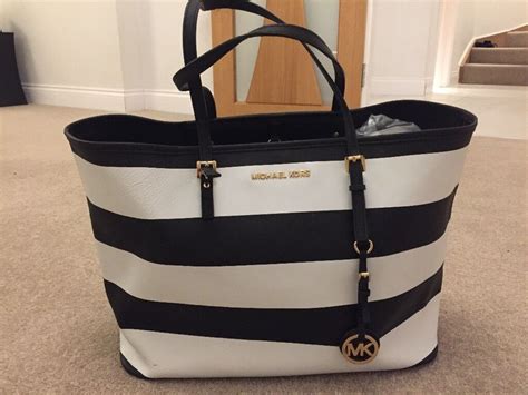 michael kors striped black and white bag|black michael kors crossbody bag.